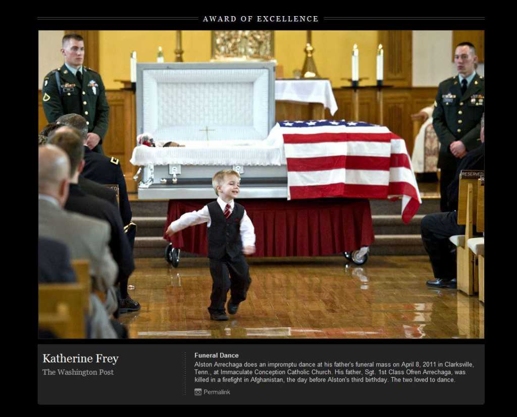 Heartbreaking picture shows Alston doing an impromptu dance, something he and his father often did, in front of his father’s flag draped coffin. 