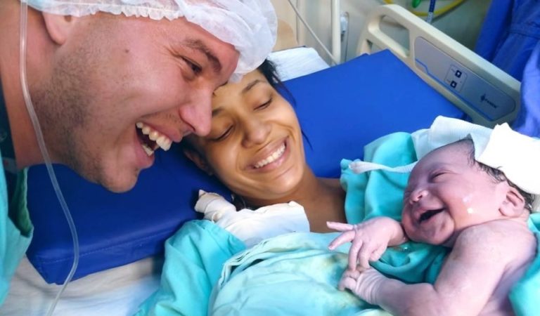 Newborn’s face lights up when she hears her daddy’s voice