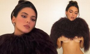 Kendall Jenner poses for racy Instagram photos, baring her underboob and a muscular midriff through her short faux fur cape