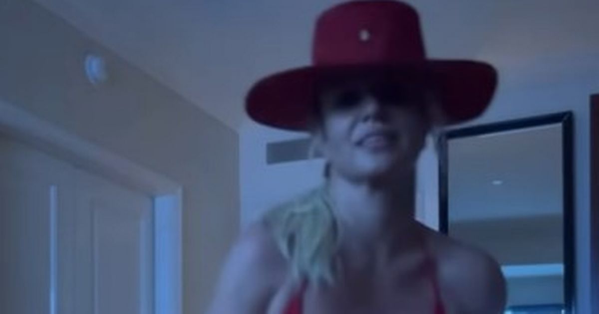 Britney Spears shows off the world’s tiniest red two-piece while dancing in the cowboy hat