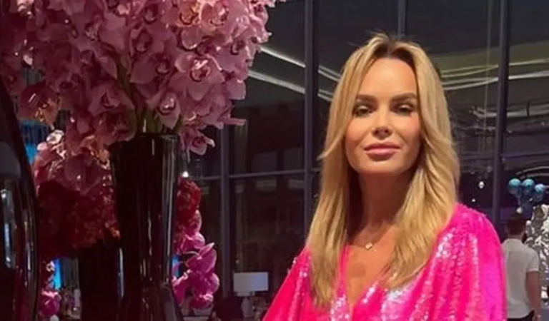 Amanda Holden showed off her killer curves as she puts on leggy display in a neon pink minidress